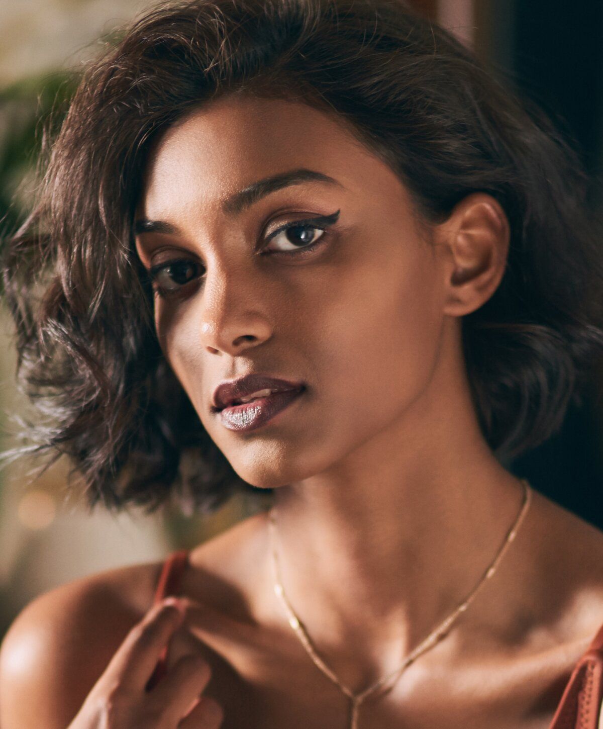 Woman with stylish hair and bold makeup.