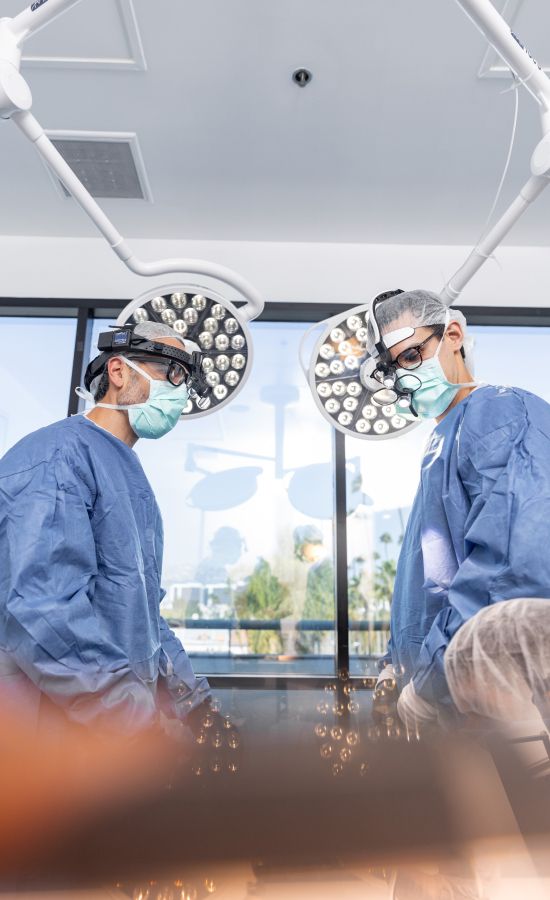 Dr. Nima Shemirani, Beverly Hills plastic surgeon with patient