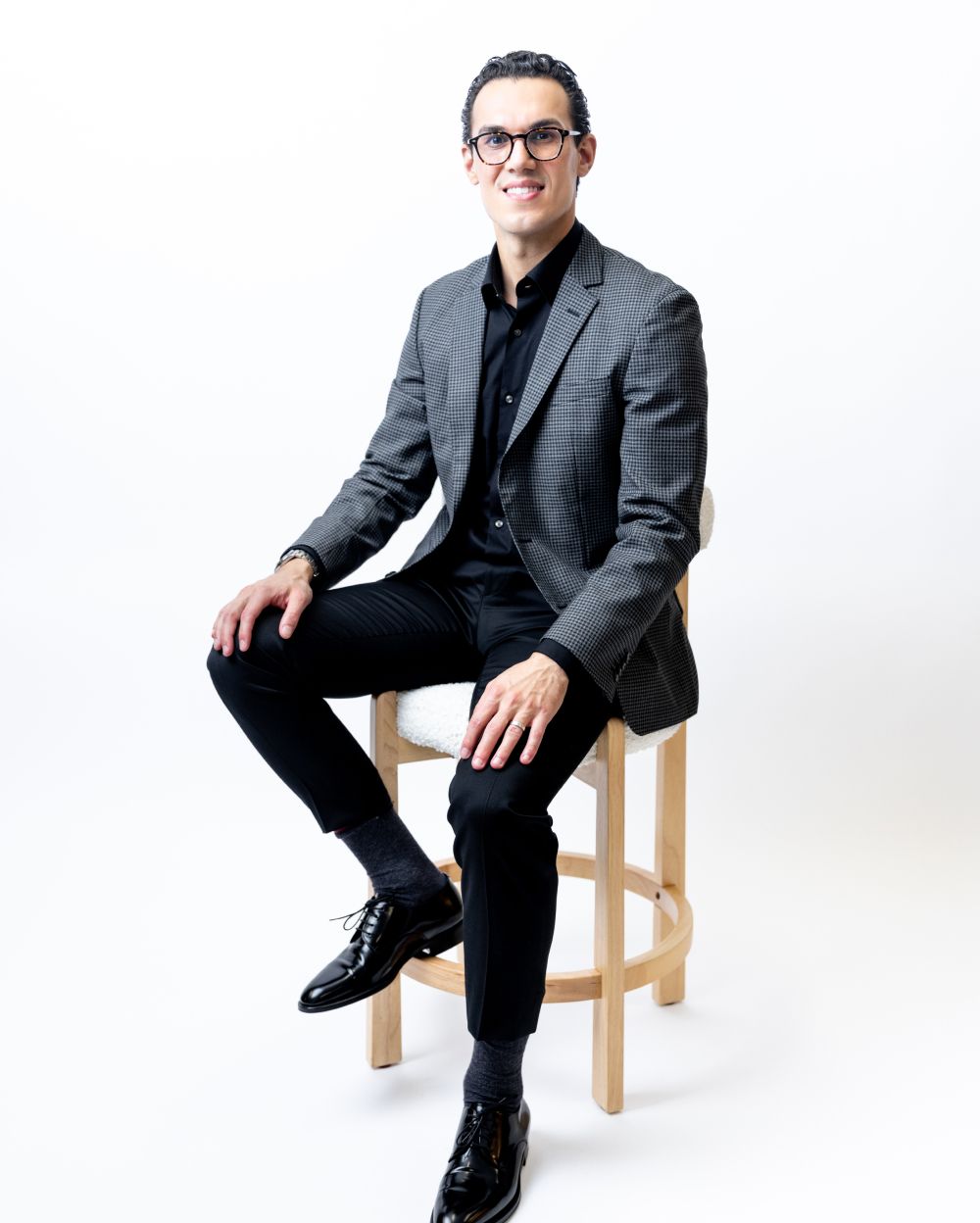 Dr. Keon Parsa posing on a chair