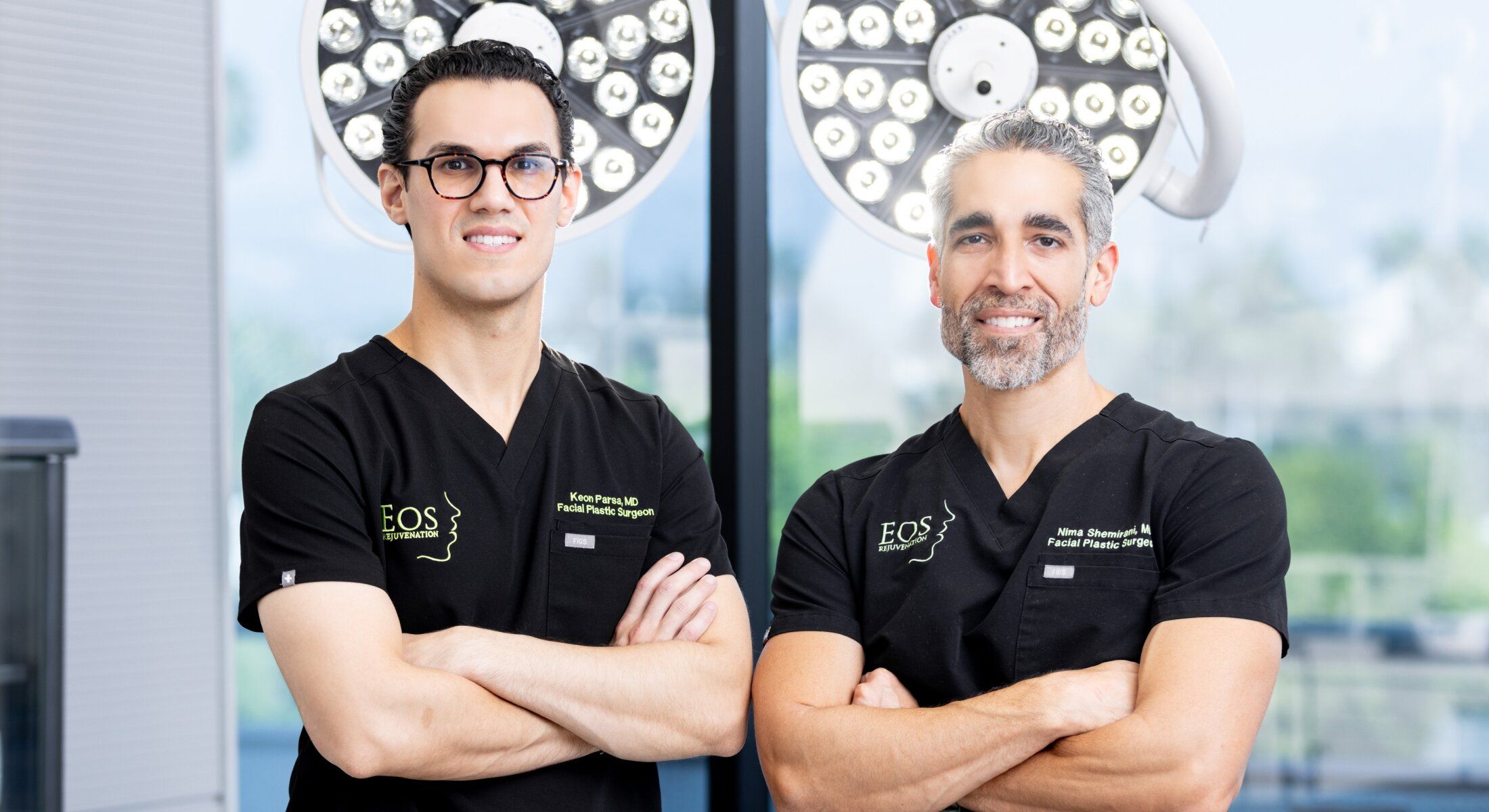 Two facial plastic surgeons in surgical attire