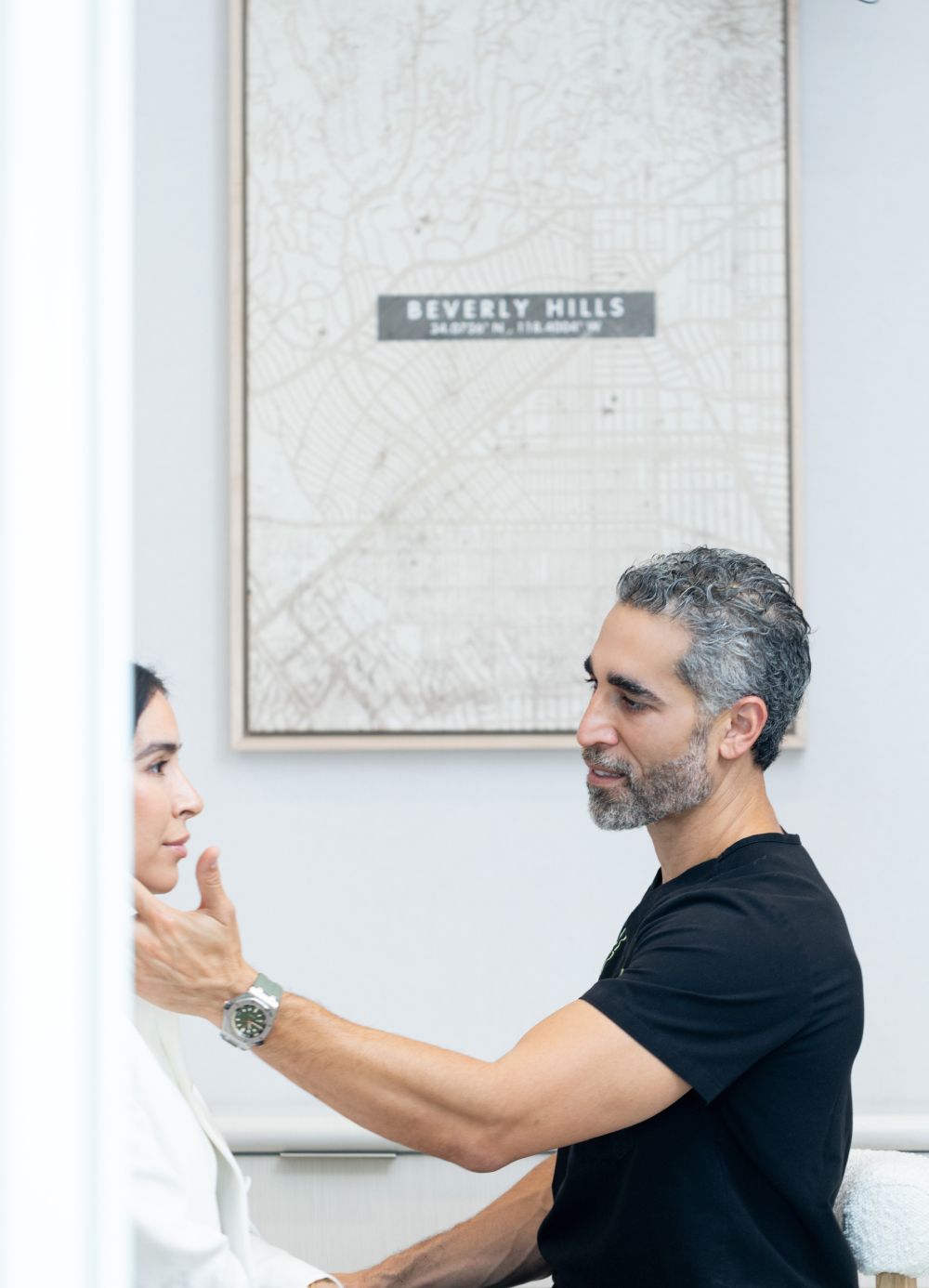 Dr. Nima Shemirani consulting with a patient