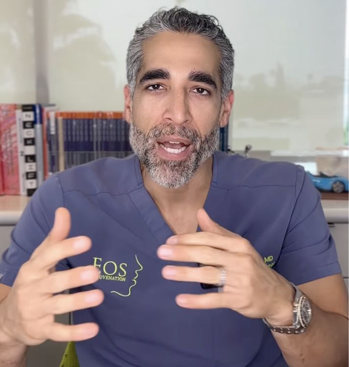 Doctor explaining procedures with hands gesturing.